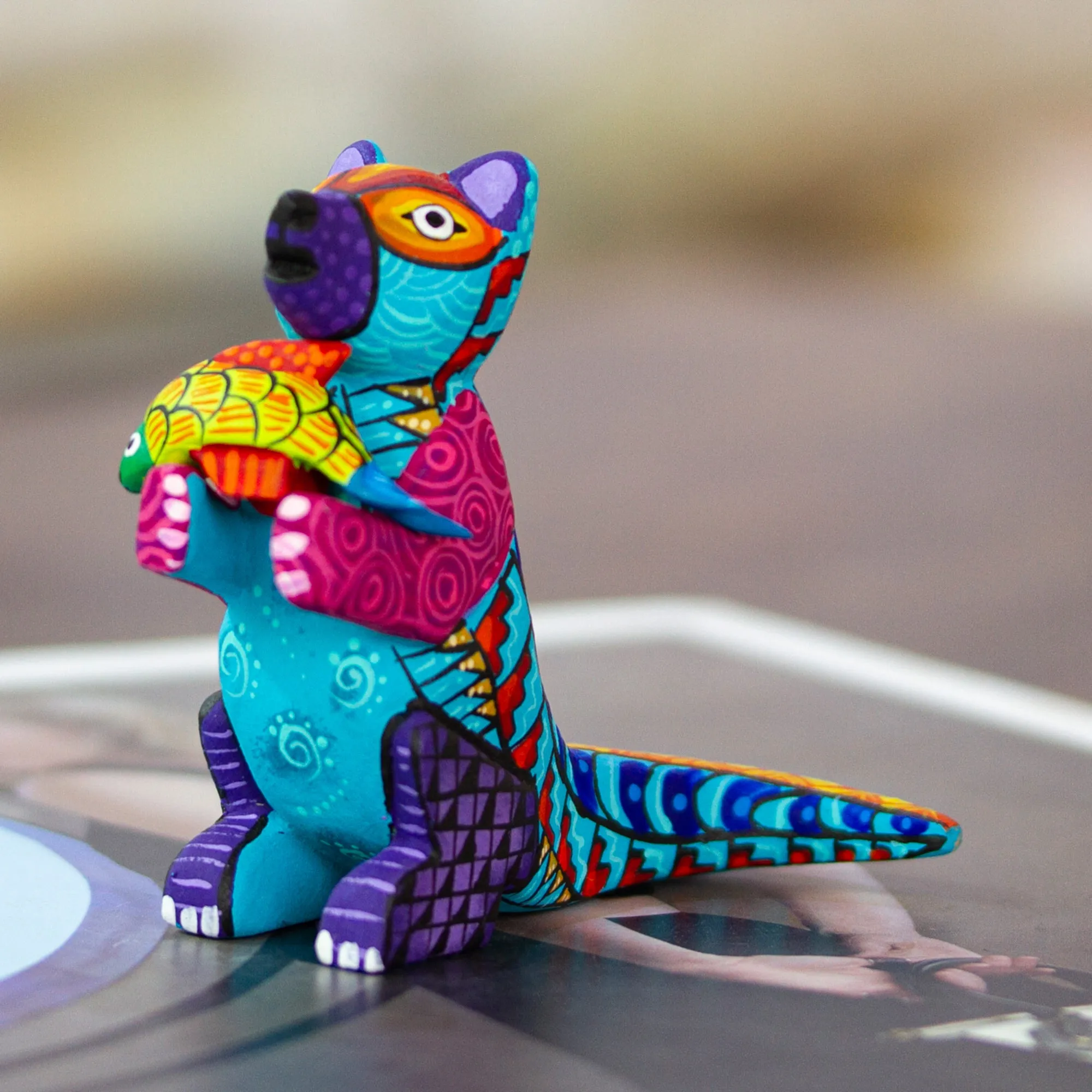 Handcrafted Turquoise Copal Wood Otter and Fish Figurine - Turquoise River Days | NOVICA